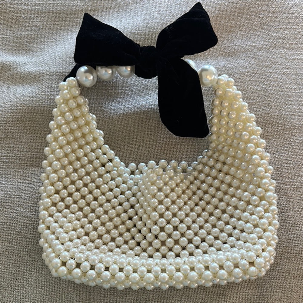 Elegant Pearl-Embellished Handbag with Black Bow